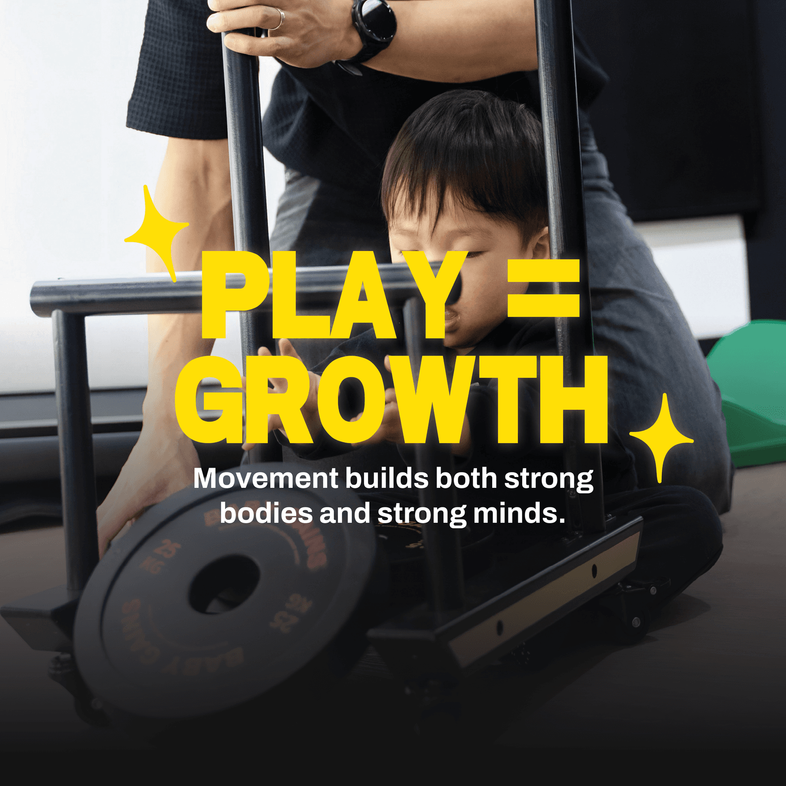 A young child mid-movement, holding a wooden BabyGains kettlebell